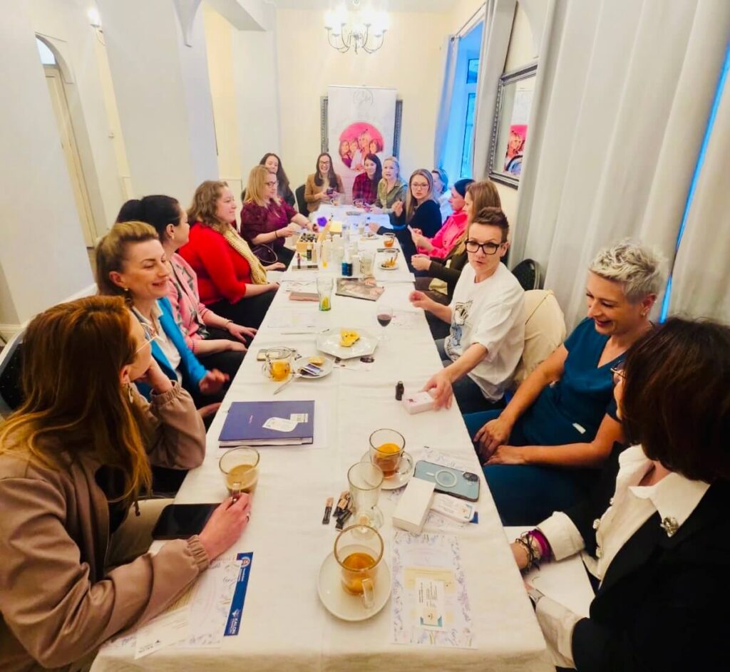 Women gathered at a She Connects CIC event in Slough, sharing connection, support, and community during a women’s empowerment gathering.